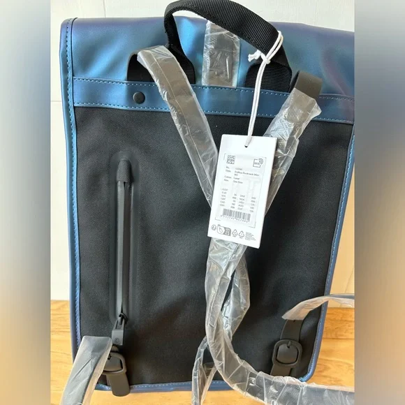 RAINS NWT Laser Blue Rolltop Rucksack Mini W3 Backpack OS #13330 Adjustable Rains Rolltop Rucksack Mini W3 – The Shop at Equinox main image 4